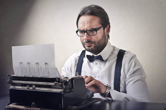 Gentleman using vintage typewriter