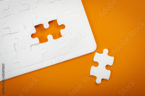 White Part Of An Orange Crossword Clue "Completing final task, missing jigsaw puzzle pieces and business