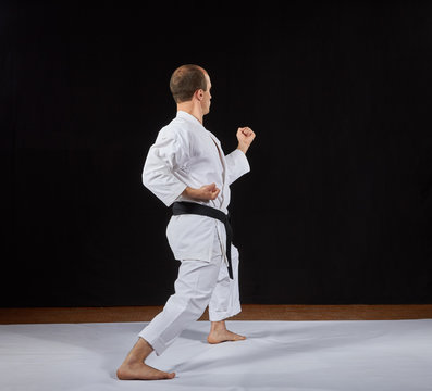 In a karate stand, a sportsman makes a block with his hand Kaderov