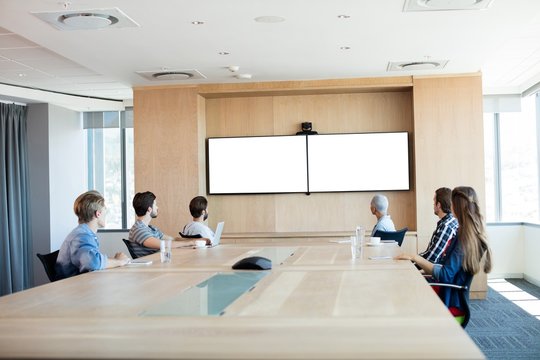 Creative Business Team Attending A Video Call In Conference Room