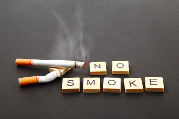 No smoke wording with cigarette on dark