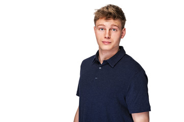 Man in navy polo t-shirt on white background with smile.