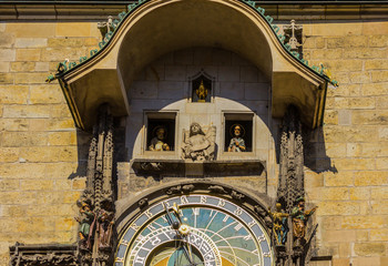 Fototapeta na wymiar The square of the Old Town and the Prague Astronomical Clock on the Gothic Tower of the City Hall . South facade. Area of the Old Town Prague, Czech Republic.