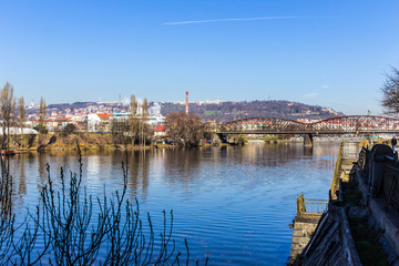 Fototapeta na wymiar View of the Vltava River in the early spring morning. Area of the Old Town Prague, Czech Republic.