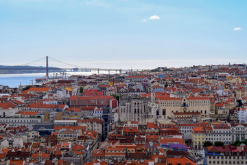 Rooftops of Lisbon looking out towards the Tagus River and the 25 de Abril Bridge in Portugal