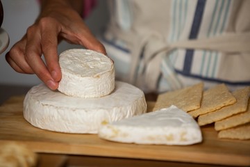 Mid-section of staff working at counter