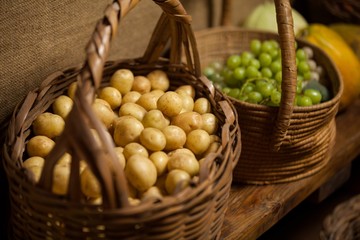 Basket full of grapes and potato at counter