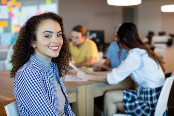 Smiling woman in office