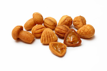 homemade cookies, nuts with condensed milk on white background
