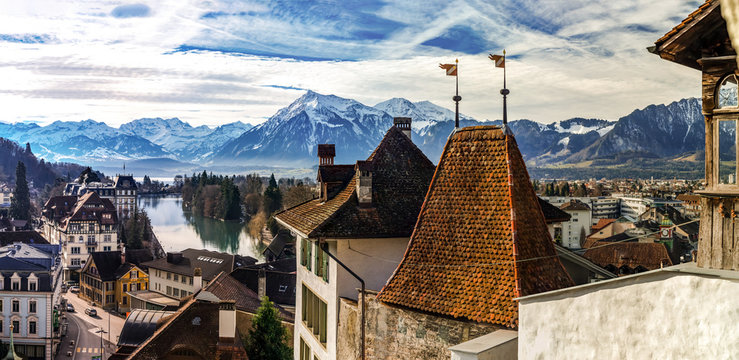 Beautiful panoramic view of Thun old city roofs and Alps on background
