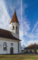 Fototapeta na wymiar Beautiful white church with high tower in Thun, Switzerland