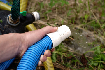 Hand With Water Hose