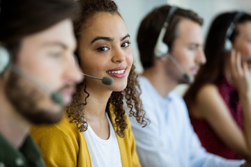 Mixed race customer service executive working at office