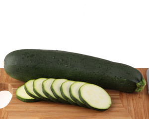 Fresh vegetables and fruits on the shredder