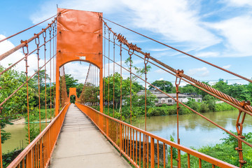 Orange bridge cross the river at Jung cave in Vang Vieng,