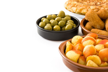 Traditional spanish tapas. Croquettes, olives,  ham and patatas bravas isolated on white background

