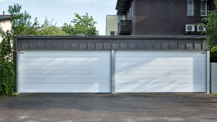 Naklejka premium Modern garage door. Large automatic roll-up garage door. 