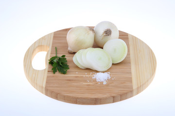 Fresh onion on the wooden board