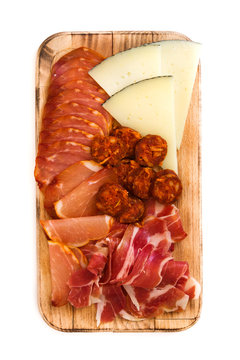 Spanish cold cuts (embutidos). Cheese, sausage and ham isolated on white background
