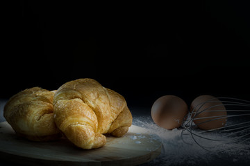 Croissant, with egg and flour.