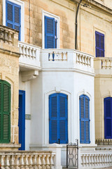 Blue Window and balcony on ancient wall Mediterranean, Malta