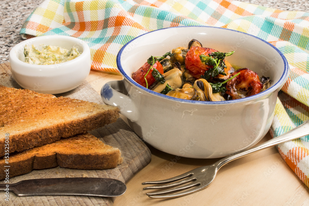 Wall mural mussels with white wine, shallot butter, roasted tomato and coriander