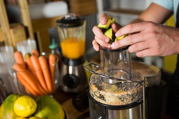 Shop assistant preparing avocado juice