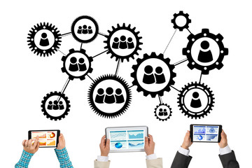 Top view of businesspeople sitting at table and using gadgets