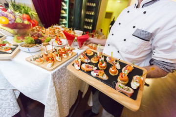 Chef serving food in restaurant