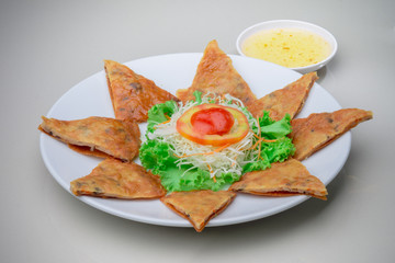 fried shrimp roti . shrimp and vegetable fritters and sweet sauce