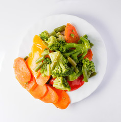Fresh vegetables on plate. Isolated