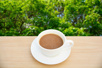 coffee cup on wood table.Top view nature backgrounds