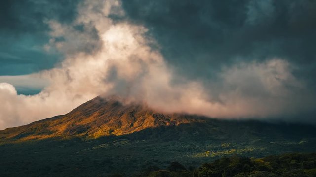 Time lapse of the summit of the volcano of Arenal covered in clouds at sunset. Costa Rica