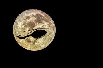 Silhouettes of  helicopter  and super moon, Full moon