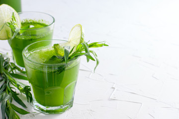 Refreshing drink made from fresh tarthun leaves with lime on white background, copy space
