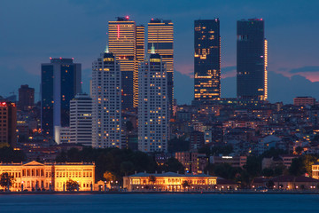 Landscape of Istanbul at night. View of lights business district from sea.  Turkey.