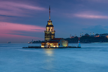 Obraz premium Beautiful landscape of Maiden's tower (Tower of Leandros) from shore. Night View on Istanbul. In the distance are such landmarks as Hagia Sophia, Blue Mosque and Topkapi Palace. Turkey.