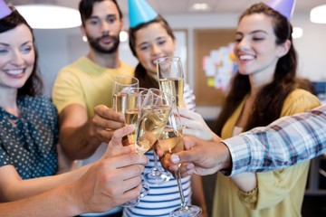 Creative business team having a toast on birthday 