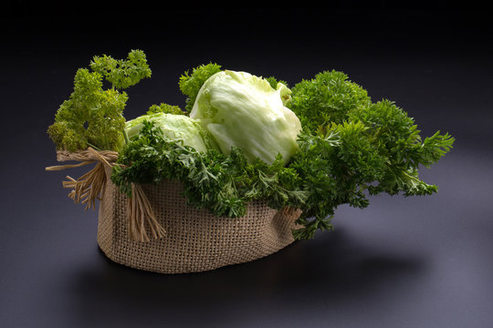 Vegetables in the basket on black background