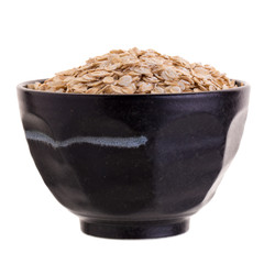 Oat in Black bowl isolated on a white background