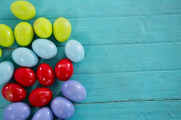 Colorful Easter eggs on wooden surface