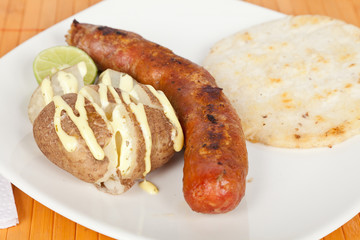 Grilled Sausage with arepa and cooked potato