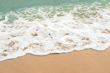 background of blue wave on the sandy beach