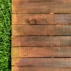 Wooden board on green grass, picnic related design template