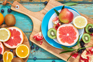 Colorful fruit on wood background