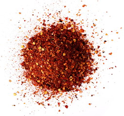 pile crushed red cayenne pepper, dried chili flakes and seeds isolated on white background