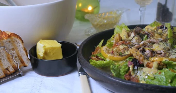 Dolly close up view of a delicious Caesar's salad