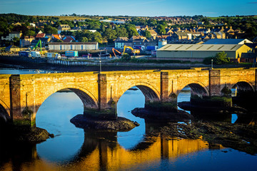 Berwick Bridge, also known as the Old Bridge, spans the River Tweed in Berwick-upon-Tweed, Northumberland, England - obrazy, fototapety, plakaty
