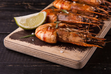 Fried big tiger shrimp on the wooden cutting board