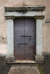 Rusty Iron Door with Granite Stone Surround